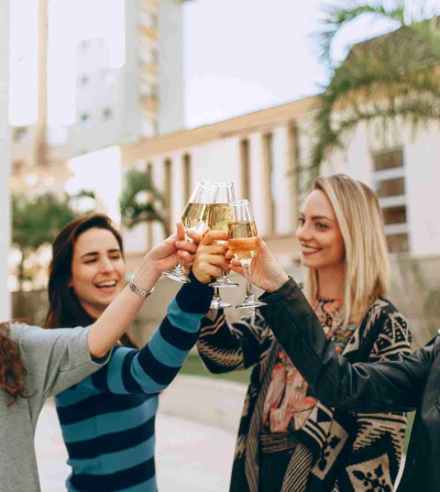 Friends gather to drink wine