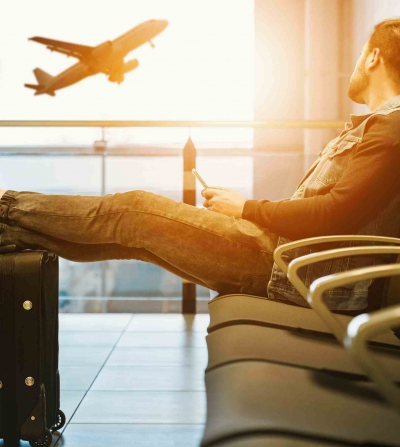 tourist awaits plane boarding during summer travel season