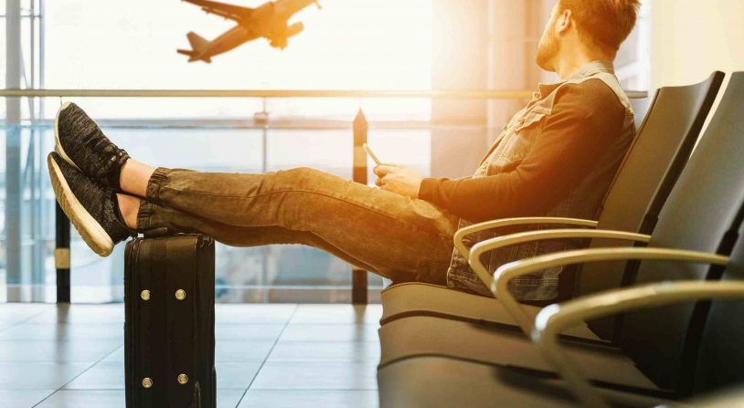 tourist awaits plane boarding during summer travel season