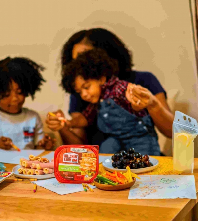 kids eating snack with their mother